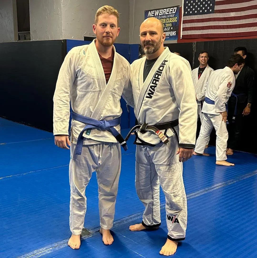 BJJ coach demonstrating technique at Warrior Academy Kennesaw